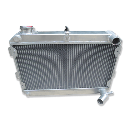 Top-down view of the radiator for the Mazda RX-7 S1, S2, and S3, displaying the filler neck, pressure cap, and durable top tank construction.