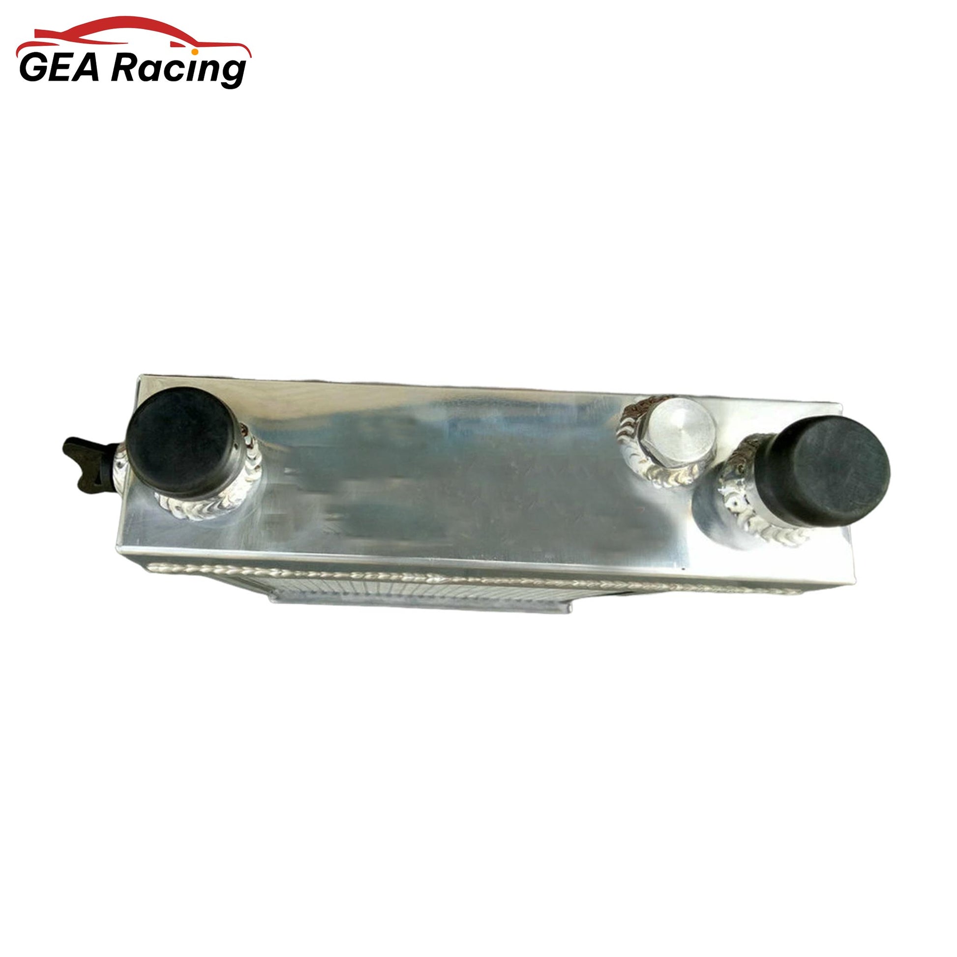 Top-down view of the 3-row aluminum radiator for the Lotus Europa, showing the filler neck, cap, and mounting points.