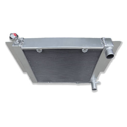 Top-down view of the aluminum radiator for Mazda RX-series S1/S2, displaying the high-pressure radiator cap, sturdy filler neck, and upper tank design.
